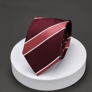 Men's burgundy striped necktie, classic formal business suit tie detail shot for office wear.