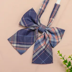 Close-up detail of Japanese JK style plaid bow tie, featuring classic blue and pink pattern.