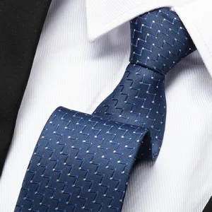 Detailed view of classic blue business tie with elegant geometric zigzag pattern for men.