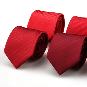 Red men business necktie detail shot showing textured striped and checkered pattern design fabric.
