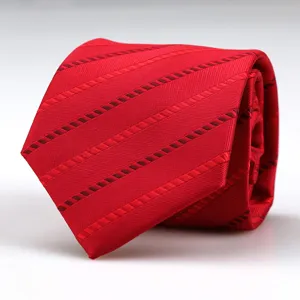 Red men's business formal necktie detail view, classic diagonal woven pattern.