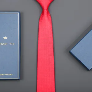 Red business tie with blue gift box, premium fabric formal wear accessory for wedding and work.