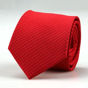 Detailed close-up of a red checkered men's woven tie, showing fine texture and clean rolled shape.