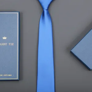 Blue silk necktie detail shot with elegant gift box packaging for formal business wear.