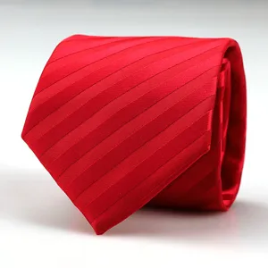 Red striped tie detail shot, showing fine textured fabric and classic wedding formal design.