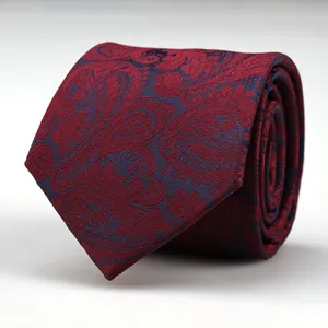 Red men's business formal tie with classic paisley pattern, perfect for wedding and work suits.