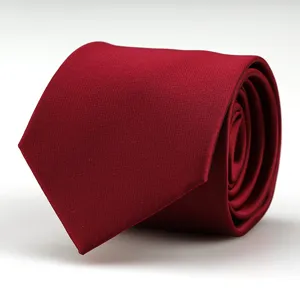 Close-up detail of a classic burgundy red men's business necktie with fine textured fabric.
