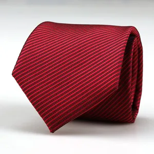 Red and black striped men necktie detail close up, elegant fabric texture for formal suits.