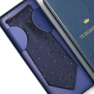 Navy blue formal men's tie with white dot pattern in elegant gift box, detailed view.