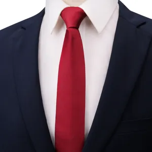 Classic men's burgundy red necktie paired with crisp white shirt and dark suit jacket.