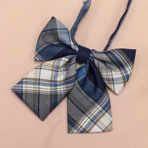 Close-up view of the blue and white plaid JK uniform bow tie, showing fine woven fabric texture.