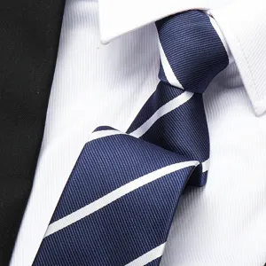 Classic navy blue mens necktie detail featuring elegant white diagonal stripes for formal business wear.