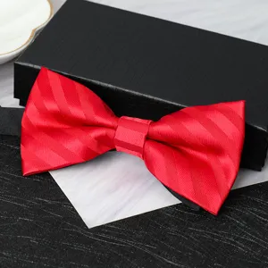 Detail view of a classic red striped bow tie with a black gift box, perfect for formal events.