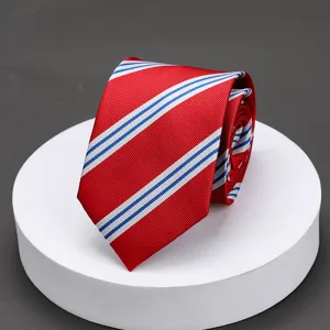 Close-up detail of the classic red striped mens necktie showing fine textured fabric.