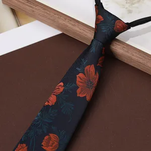 Close-up of mens vintage floral zipper necktie, dark blue fabric with red botanical pattern details.
