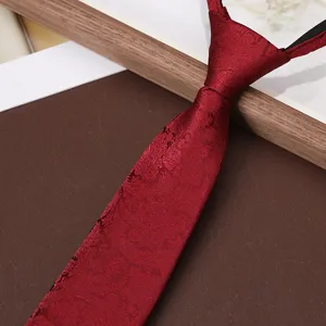 Detailed view of dark red pre-tied zipper tie with vintage texture, elegant business style.