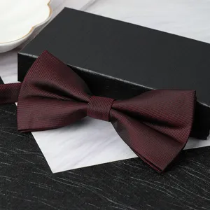 Burgundy double-layer men's bow tie detail shot, elegant formal wear accessory for weddings.
