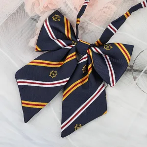 JK uniform bow tie with navy blue stripes and gold crest embroidery for cute school style.
