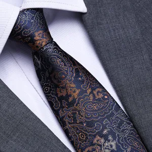 Detailed view of elegant men's blue business tie featuring intricate paisley patterns.