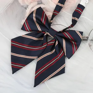 Detailed view of dark blue JK uniform bow tie with red beige stripes, ideal for sailor shirts.