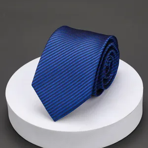 Detailed view of the classic blue striped men's tie, showing fine texture and neat roll.