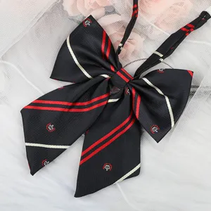JK uniform black bow tie with red white stripes and crown embroidery detail closeup accessory