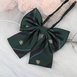 Dark green JK plaid bowtie detail, featuring exquisite gold crest embroidery and long ribbons.