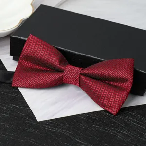 Detail view of a wine red double-layer bow tie with fine herringbone pattern for formal wear.
