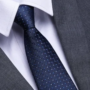 Men's blue business tie with geometric pattern, perfect for formal wear and weddings.