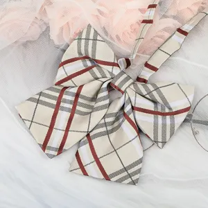 Detailed view of a classic plaid bowknot JK collar ribbon accessory for uniform shirts.