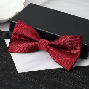 Detailed view of wine red textured double bow tie showcasing fine fabric and elegant craftsmanship.