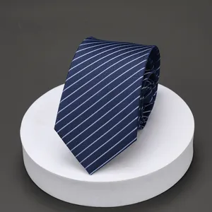 Detailed view of men's blue striped necktie on white podium, perfect for business formal.