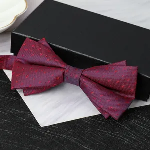 Detailed closeup view of the elegant burgundy double layer bow tie presented on a black gift box.