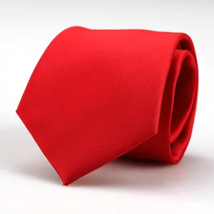 Close-up view of the rolled bright red necktie for men formal business wear.