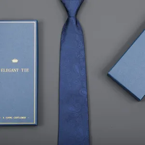 Detail view of blue paisley tie with elegant gift box packaging for business men formal wear.