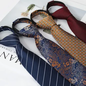 Close-up of four stylish zipper neckties featuring classic stripes, paisley, and polka dot patterns.