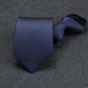 Close-up view of the dark blue textured zipper tie detail, ideal for professional business suits.