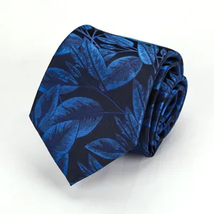 Detailed view of a dark blue necktie featuring an elegant blue leaf pattern texture.