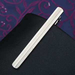 Silver metal tie clip detail view, classic design for men business suit and formal wear style.