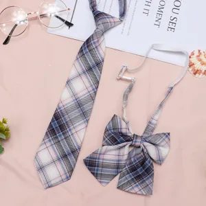 Detailed view of JK uniform plaid necktie and bow set featuring pink and blue checkered design.
