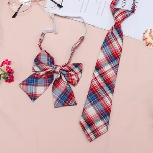 Close-up detail of the JK uniform plaid tie and bow set, featuring classic red and blue patterns.