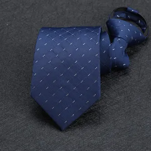 Men's business formal blue pre-tied zipper necktie close-up showing fine dotted grid pattern.