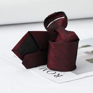 Burgundy zipper tie with subtle polka dots, elegant business necktie accessory for men.