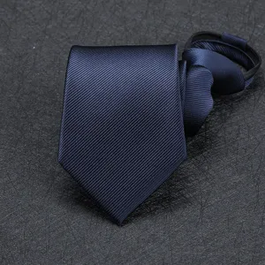 Close up detail of navy blue twill fabric men zipper necktie, elegant texture display.