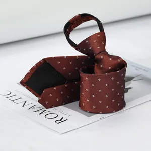 Detailed view of a reddish-brown patterned zipper tie with fine grid texture on white surface.