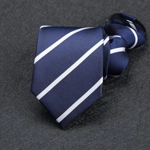 Close-up detail of a navy blue men's zipper necktie featuring classic white diagonal striped pattern.