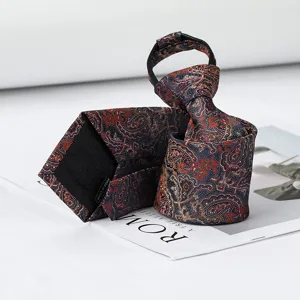 Detailed view of a stylish navy blue zipper tie featuring an intricate orange paisley pattern.