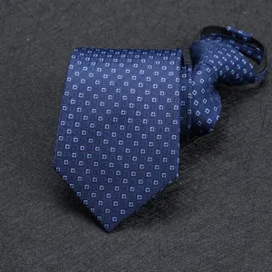 Detail view of a navy blue patterned zipper necktie featuring a subtle geometric square design.