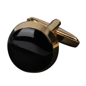 Boutons de manchette ronds dorés et noirs pour chemise habillée costume d'affaires.