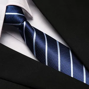 Close-up of business striped necktie detail, blue tie with white shirt and black suit.